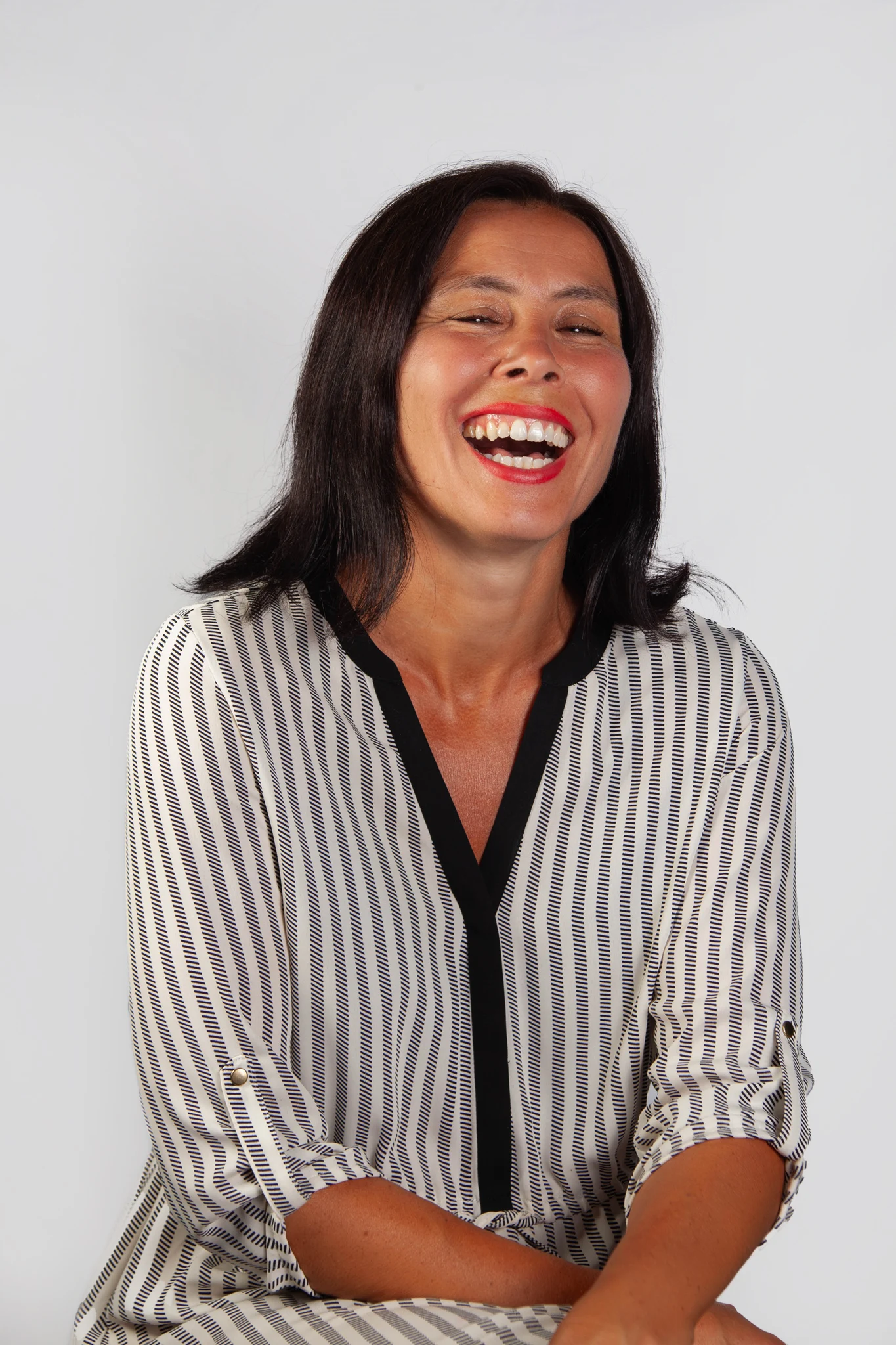 Happy laughing female headshot photograph