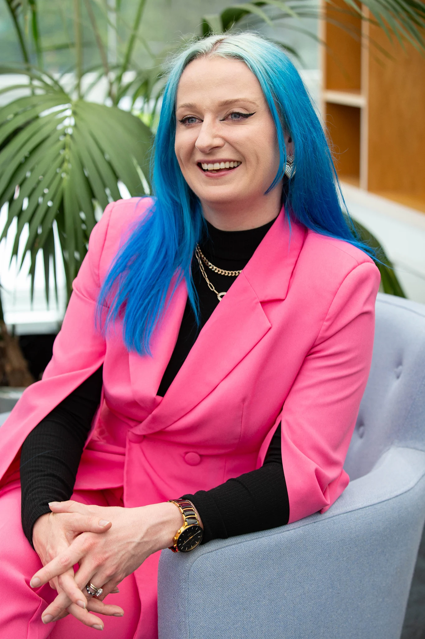 Lifestyle headshot photography - female with blue hair & bright clothes