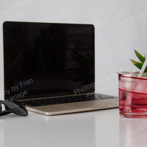 Summer business stock preview image from Photography by Fran - open laptop with pineapple and sunglasses
