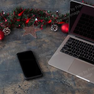 Business Christmas stock preview image from Photography by Fran - open laptop with phone and Christmas decorations