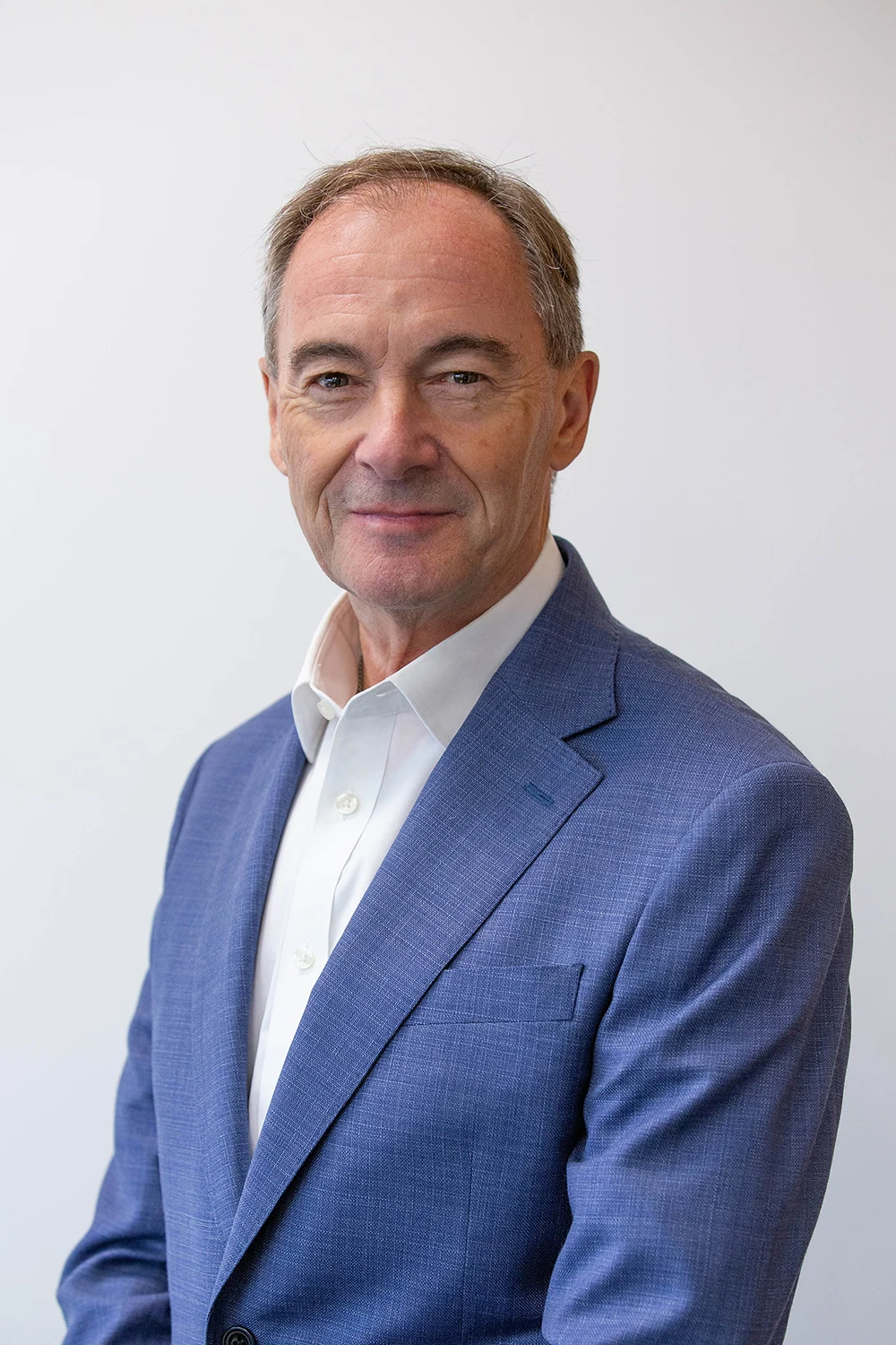 Corporate male headshot - traditional photograph against white background